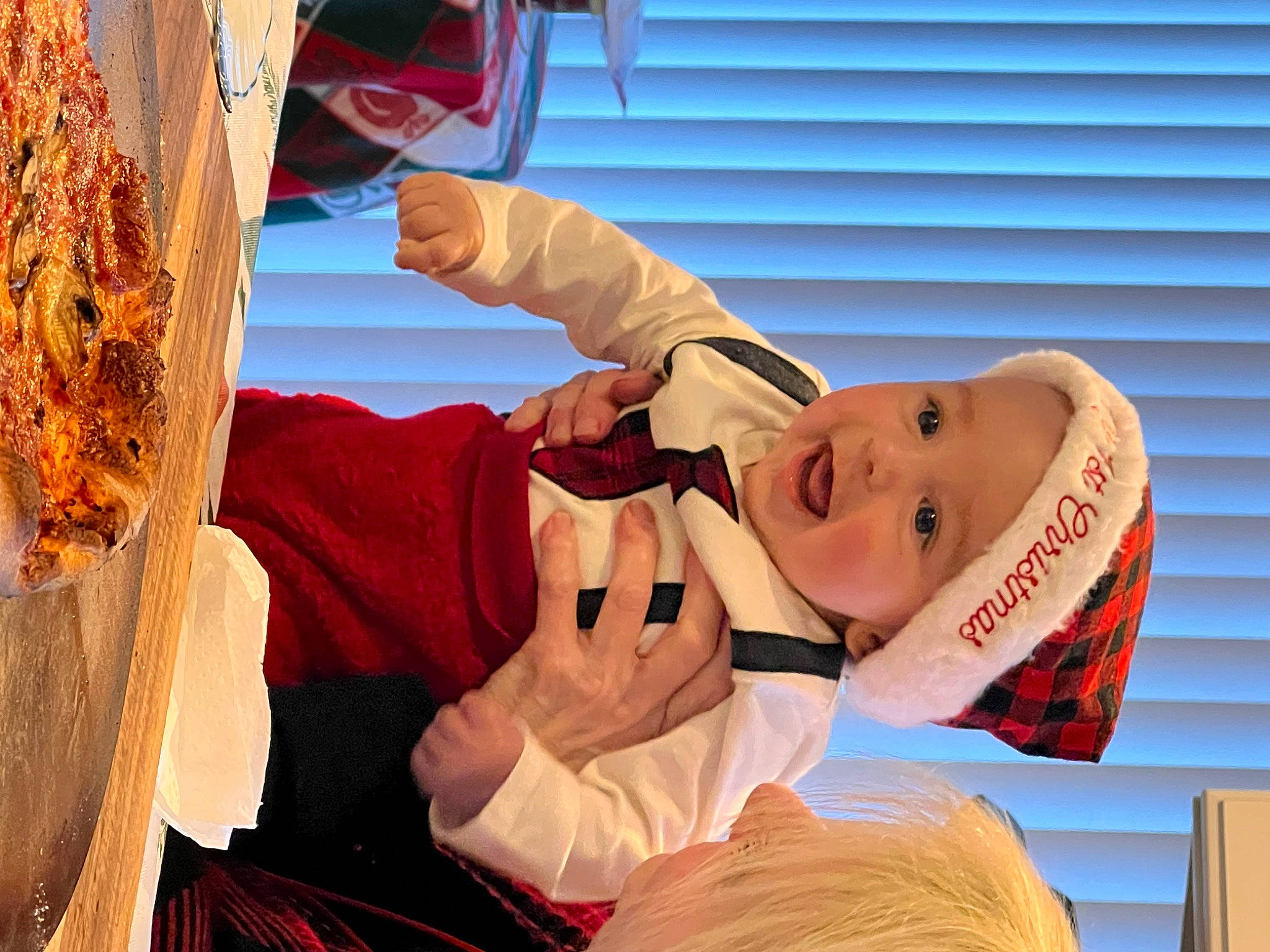 Mikey is registered to the contest to win money with this photo: child, fast_food, food, fun, happy, hat, headwear, junk_food, leisure, orange, person, room, vacation, wood