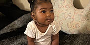 Kyzah joined the competition — help win amazing prizes! baby, bed, bottle, child, cozy, curly_hair, cute, expression, foot, hair_buns, hand, indoors, infant, nursery, nursing_pillow, pink_pants, sitting, skin, soft_lighting, white_shirt