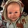 Sunnie is registered to the contest to win money with this photo: baby, child, hooded_onesie, smiling, indoor, blue_eyes, face, cozy_clothing, patterned_fabric, zipper, cute, portrait, infant, warm, soft_texture, young_child, clothing, headwear, baby_clothes, closeup