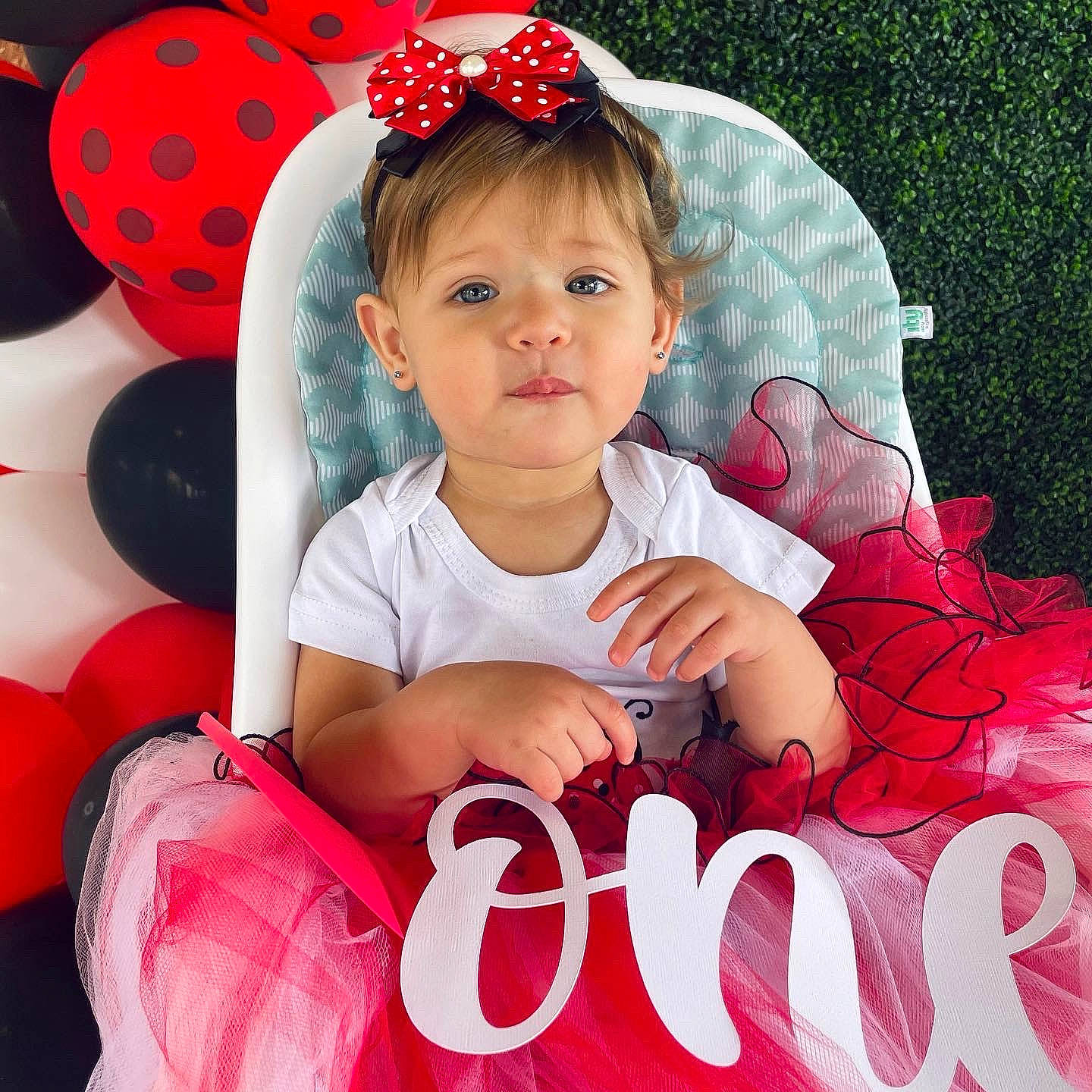 Luella is registered to the contest to win money with this photo: arm, baby, baby_toddler_clothing, child, cool, face, facial_expression, font, fun, happy, head, organ, person, pink, plant, poster, product, red, sleeve, toddler