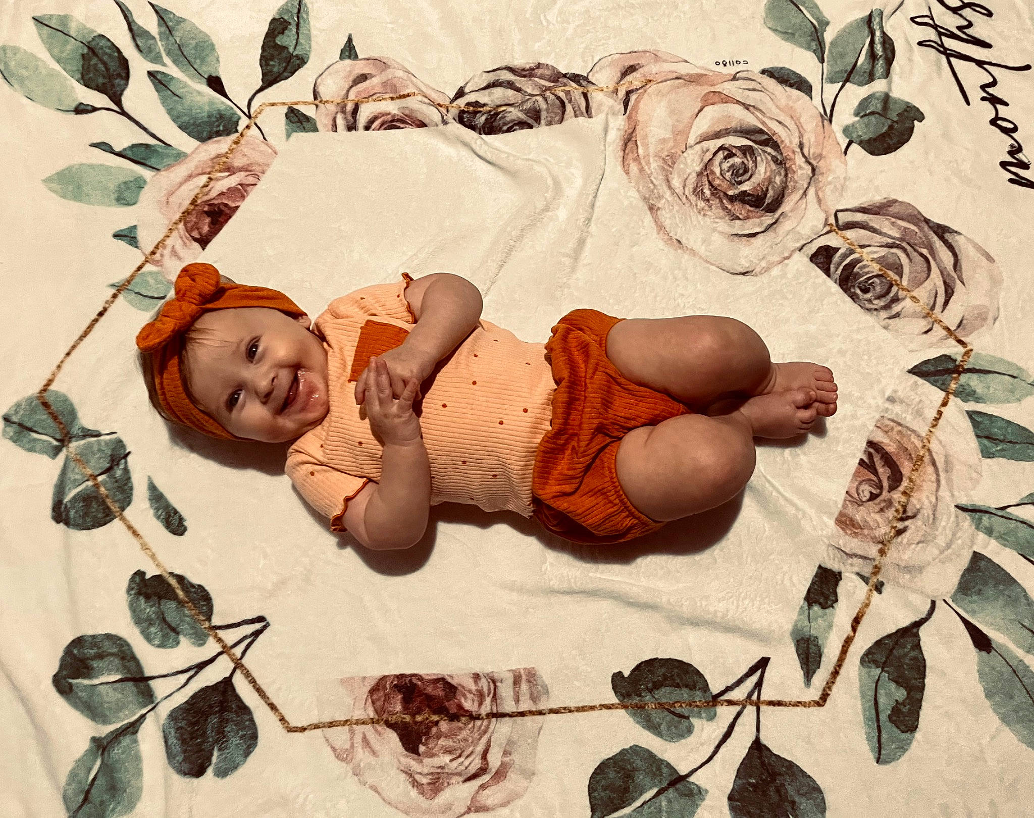 Maeve is registered to the contest to win money with this photo: arm, art, baby, child, comfort, fashion_accessory, happy, hat, head, headgear, headwear, illustration, joy, organism, pattern, people_in_nature, person, smile, sun_hat, toddler