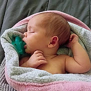Ila joined the competition — help win amazing prizes! baby, bare_shoulders, blanket, closed_eyes, cozy, ear, face, hair, hand, indoors, infant, lying_down, newborn, pacifier, pink, plush, portrait, relaxed, sleeping, soft_texture