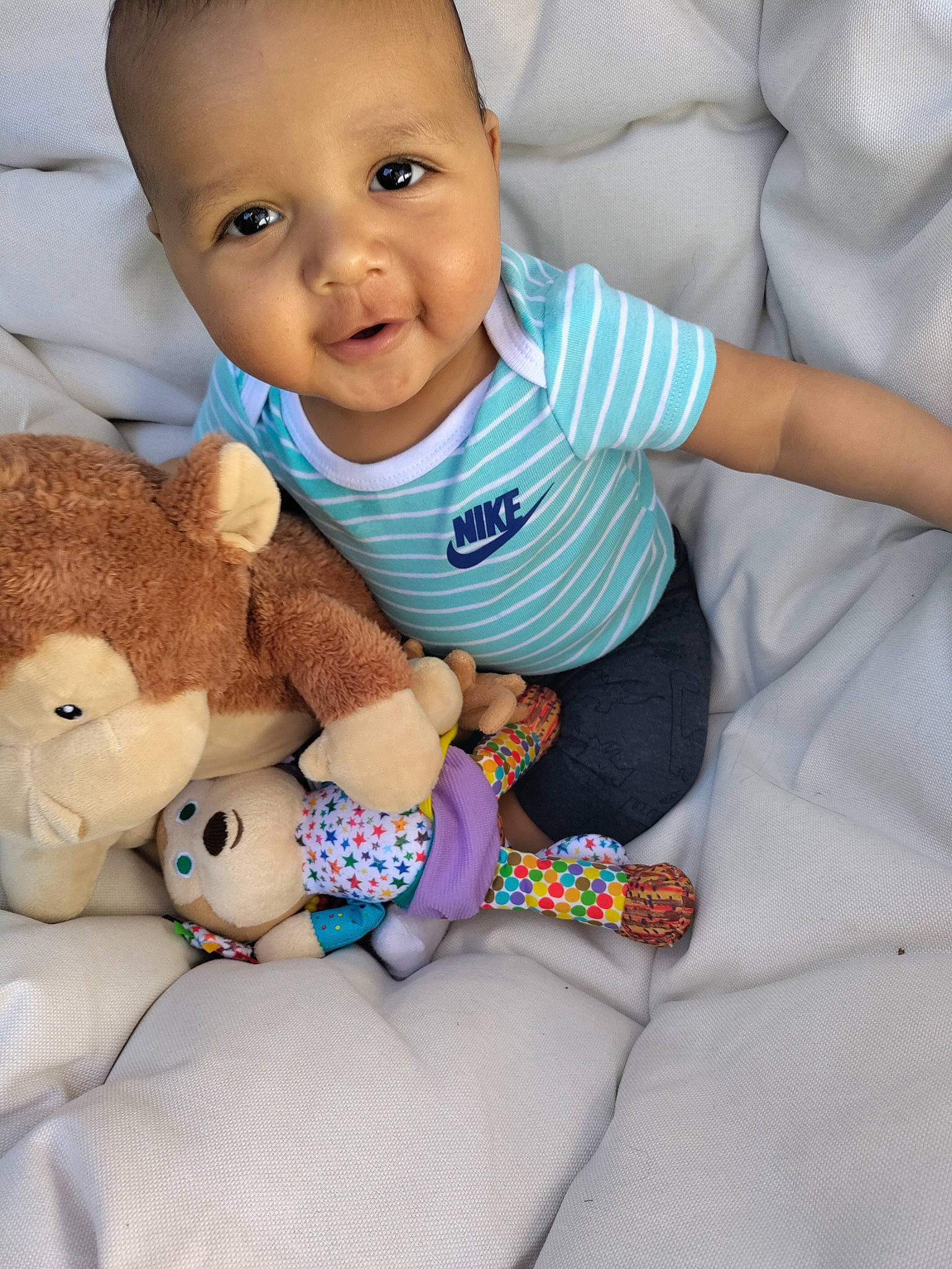 Memphis is registered to the contest to win money with this photo: arm, baby, baby_sleeping, baby_toddler_clothing, cheek, comfort, eye, face, finger, hand, happy, head, nose, person, skin, sleeve, smile, textile, toddler, toy