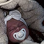 baby, sleeping, pacifier, headband, blanket, fur, cozy, infant, cute, closeup, face, child, wearing, bundle, comfort, soft, peaceful, adorable, resting, indoors