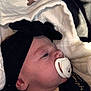 Tiyanna participe au concours pour gagner de l'argent avec cette photo : baby, pacifier, headband, blanket, infant, sleepwear, face, skin, closeup, clothing, newborn, cute, soft, indoors, child, portrait, resting, black, white, peaceful