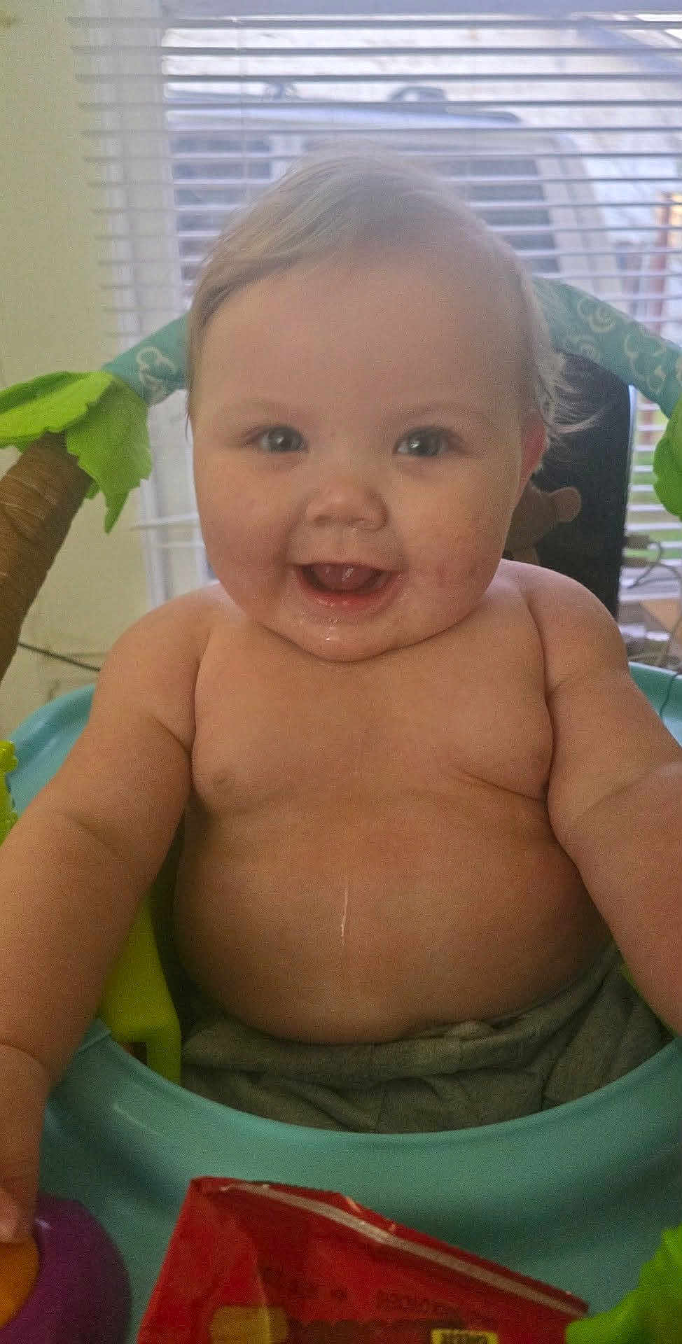 Raina-Lynn joined the competition — help win amazing prizes! baby, smiling, child, indoor, seat, toy, window, blinds, happy, face, skin, hair, cheeks, arms, chubby, mouth, eyes, clothing, furniture, daylight