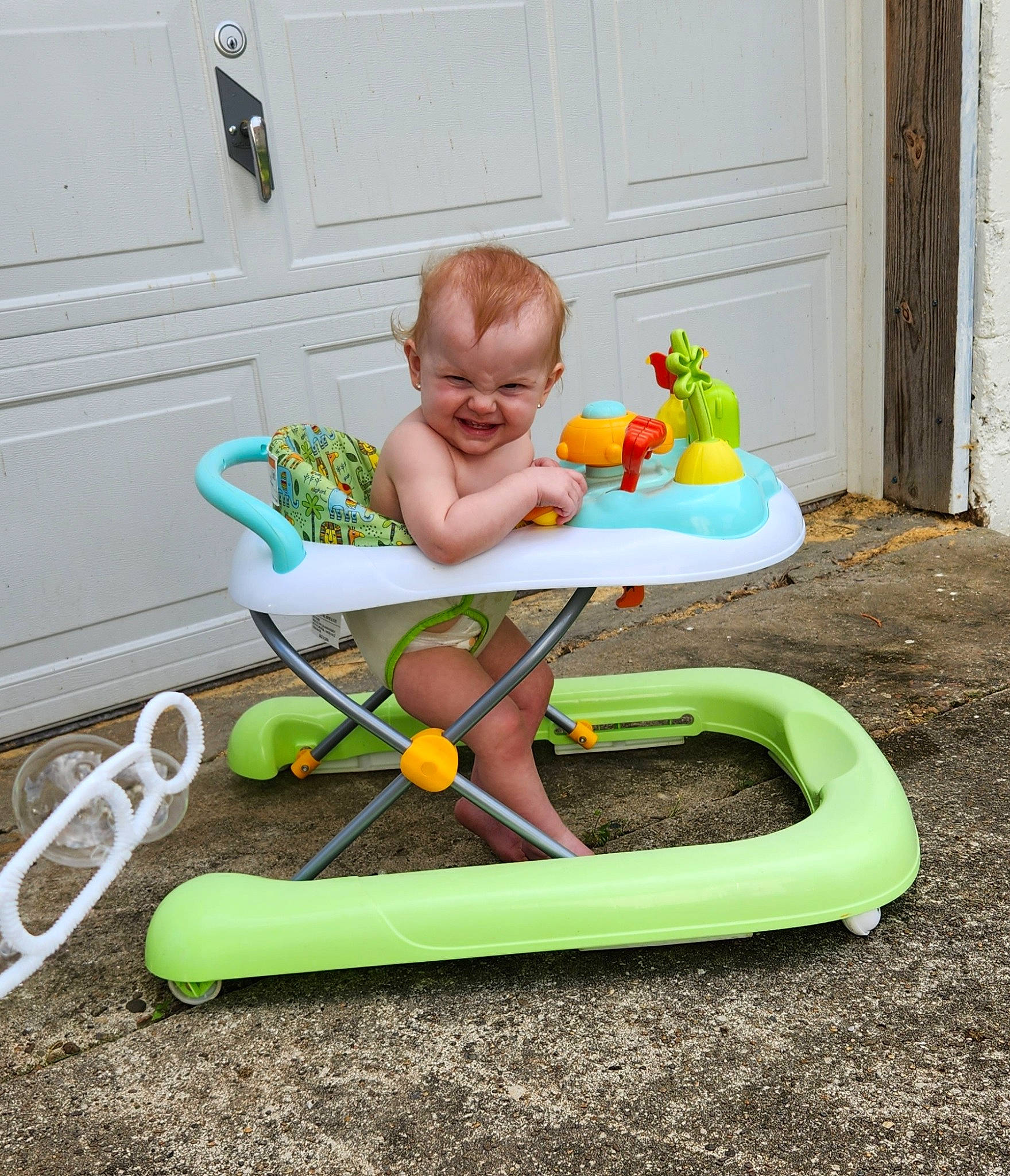 Allison is registered to the contest to win money with this photo: baby, baby_playing_with_toys, baby_products, baby_safety, baby_toddler_clothing, baby_toys, chair, child, comfort, door, folding_chair, fun, garden_tool, grass, joy, leisure, outdoor_furniture, person, play, sitting