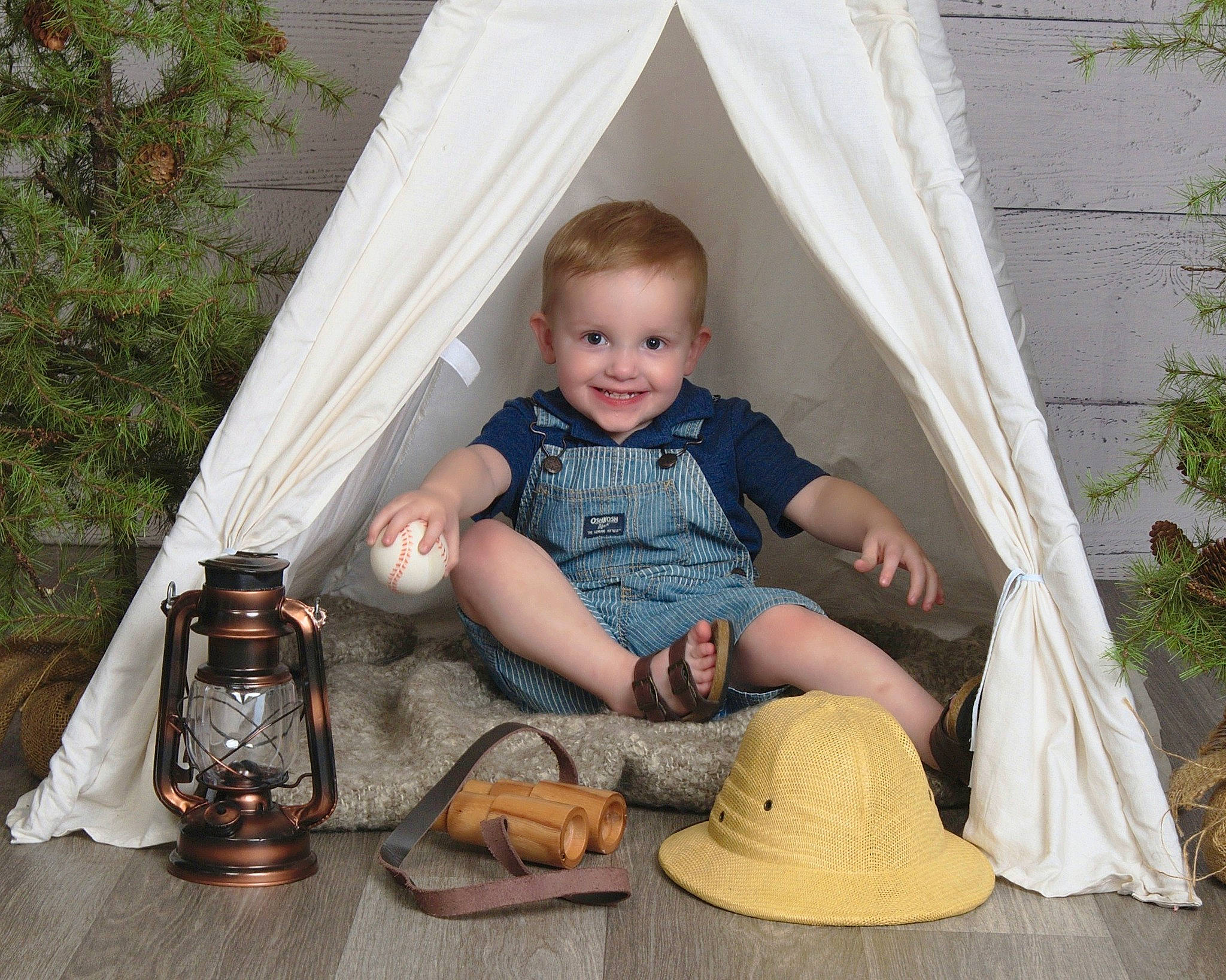 Elijah is registered to the contest to win money with this photo: child, event, fun, grass, hat, home, house, joy, leisure, person, plant, room, shoe, sitting, smile, sneakers, sombrero, sun_hat, t_shirt, toddler
