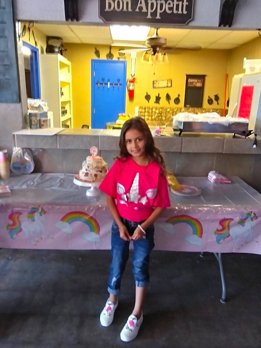 Mckayla is registered to the contest to win money with this photo: child, event, fun, happy, indoor_games_and_sports, joy, leisure, person, play, public_space, recreation, room, sandal, shorts, sitting, smile, standing, t_shirt, toddler, travel