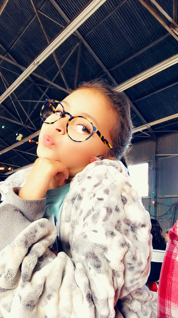 Mckayla joined the competition — help win amazing prizes! black_hair, child, eyelash, eyewear, fashion_design, flash_photography, fun, fur, glasses, happy, jaw, lip, pattern, person, personal_protective_equipment, portrait_photography, sitting, skin, street_fashion, toy