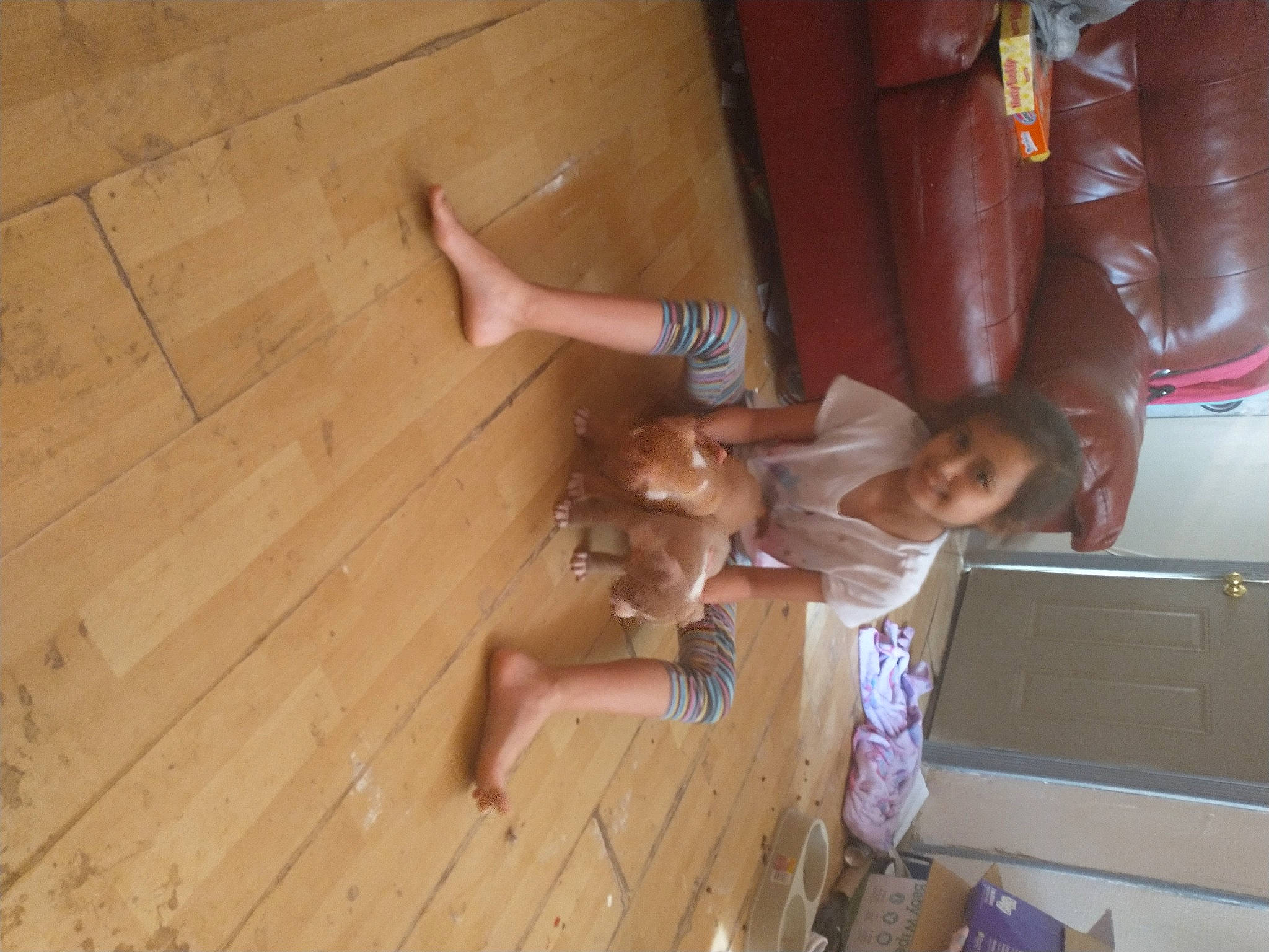 Mckayla is registered to the contest to win money with this photo: ceiling, child, elbow, flooring, foot, fun, hardwood, human_leg, joy, knee, leisure, person, plank, room, shorts, thigh, thumb, toddler, varnish, wood