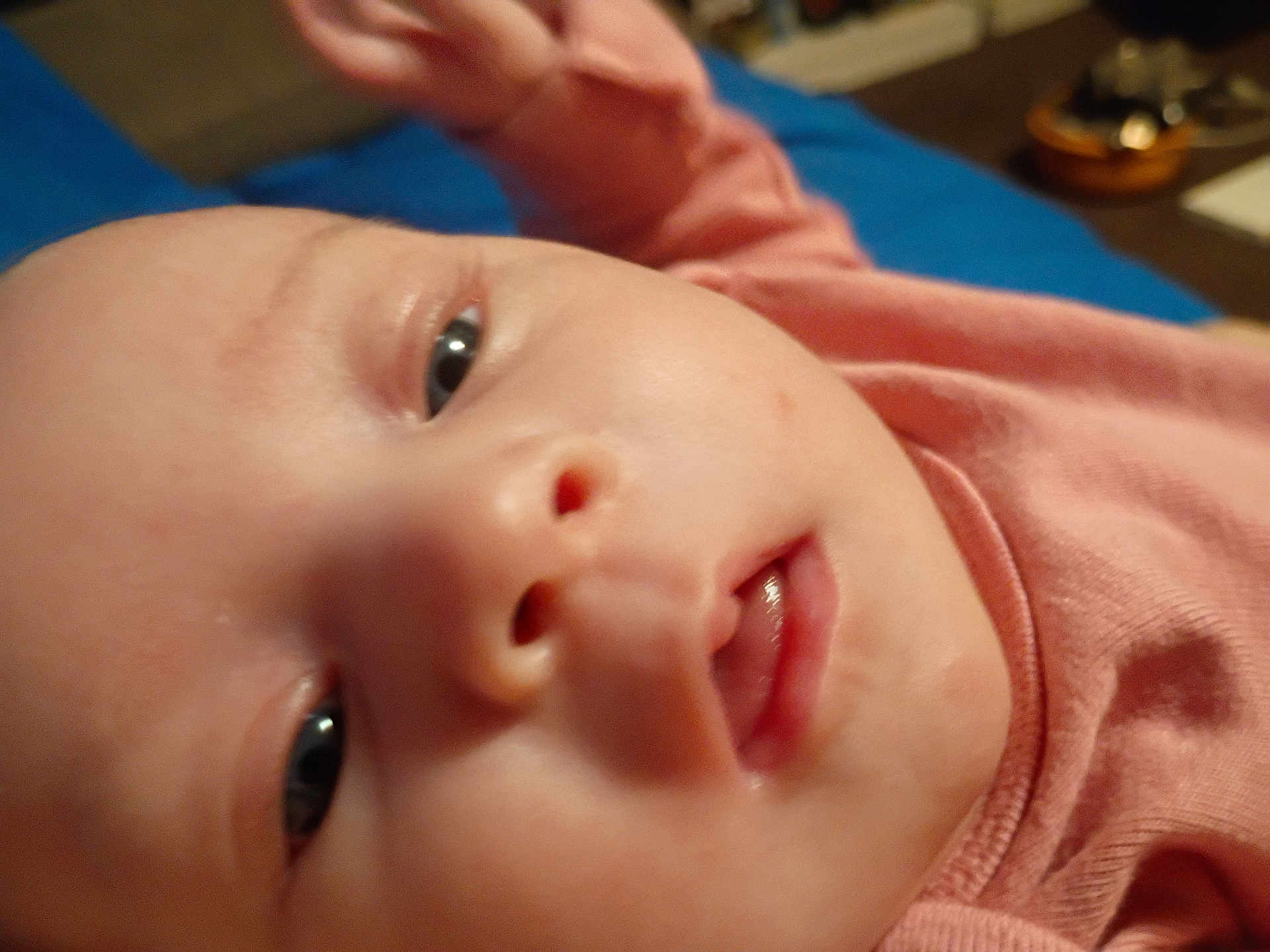 Charlotte joined the competition — help win amazing prizes! baby, close_up, face, infant, pink_clothing, skin, eyes, mouth, nose, indoor, person, child, newborn, portrait, cute, young, expression, soft_light, blurred_background, head