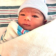 Zayan is registered to the contest to win money with this photo: newborn, baby, infant, wrapped, blanket, hat, hospital, face, eyes, cute, sleepy, soft, skin, portrait, closeup, child, newborn_baby, headwear, lying_down, indoors