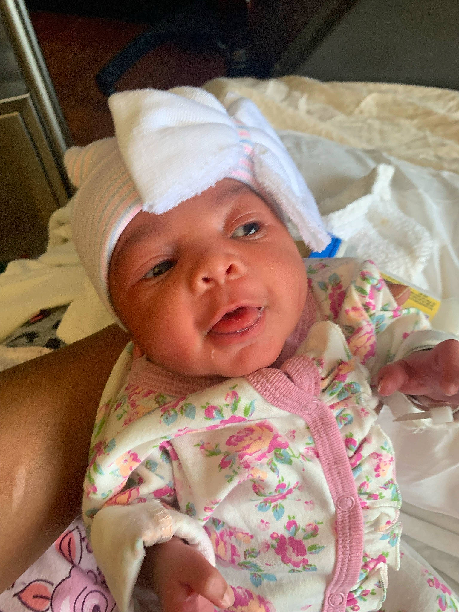 Miracle is registered to the contest to win money with this photo: baby, baby_laughing, baby_toddler_clothing, cheek, child, chin, comfort, face, happy, head, headwear, linens, lip, mammal, mouth, nose, person, pink, skin, sleeve