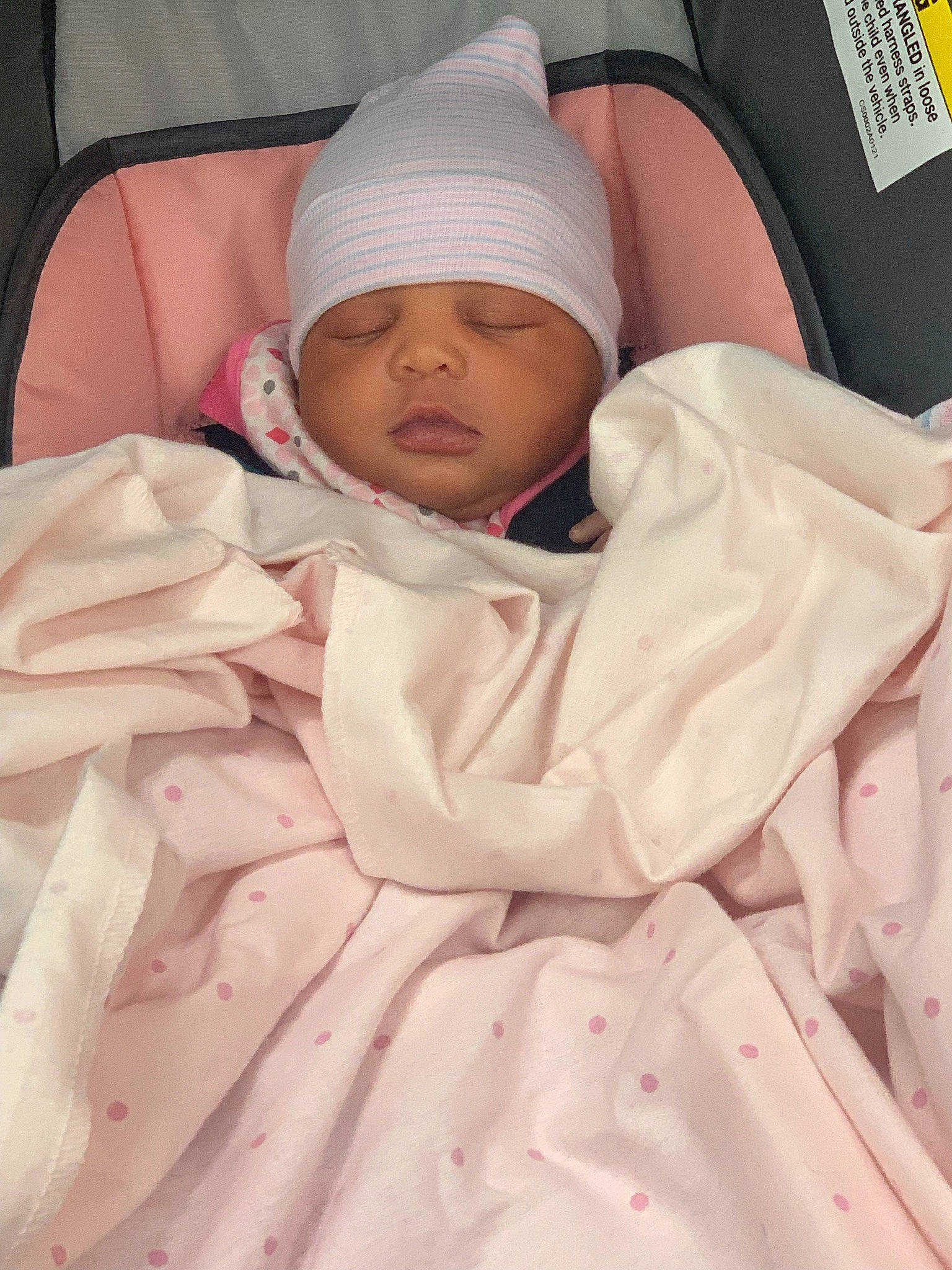 Miracle is registered to the contest to win money with this photo: baby, baby_sleeping, child, comfort, face, head, headwear, linens, peach, person, pink, room, sleep, sleeve, thumb, toddler