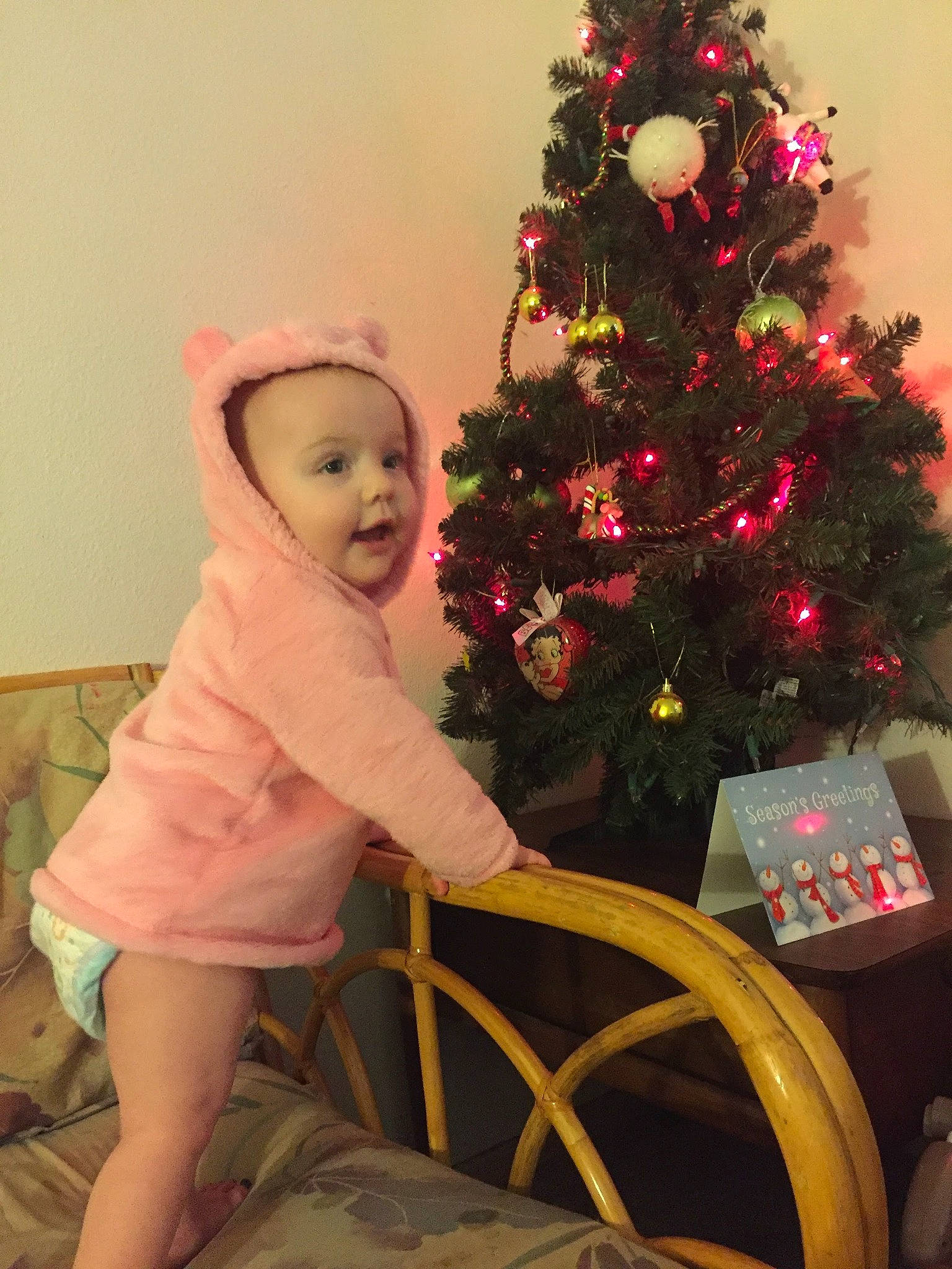 Delilah And Kinzley joined the competition — help win amazing prizes! baby_toddler_clothing, christmas_decoration, christmas_eve, christmas_ornament, christmas_tree, conifer, event, evergreen, happy, holiday, holiday_ornament, human_body, ornament, person, pink, plant, sleeve, standing, tints_and_shades, toddler