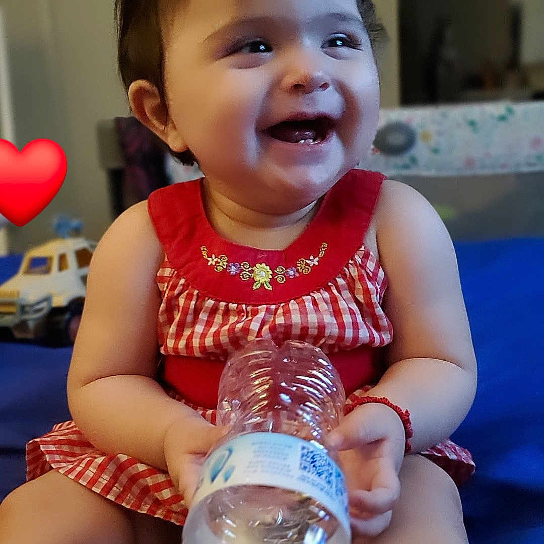 Ava joined the competition — help win amazing prizes! baby, beverage, bodypart, bottle, boy, car, child, face, finger, hand, happy, head, jar, male, person, photography, portrait, sitting, transportation, waterbottle