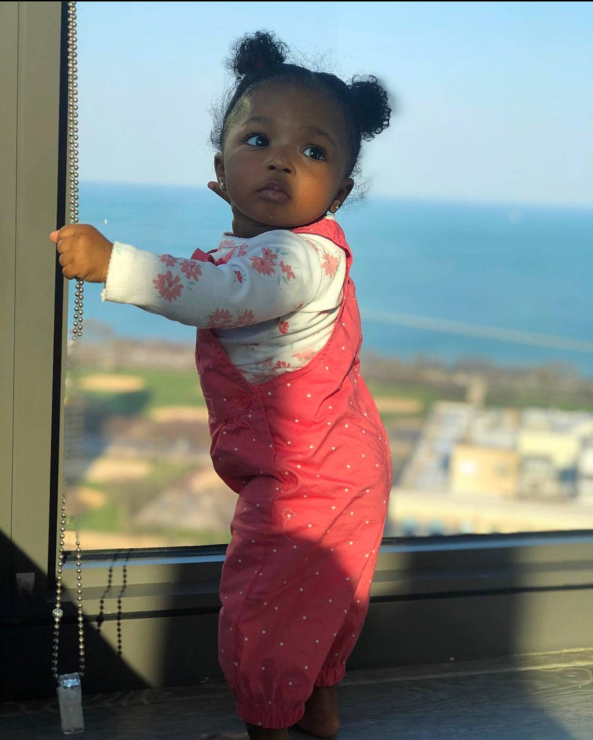 Sanaa is registered to the contest to win money with this photo: arm, baby_toddler_clothing, black_hair, child, dress, elbow, eye, flash_photography, fun, hand, happy, human_body, human_leg, leisure, person, shoulder, sky, sleeve, toddler, waist