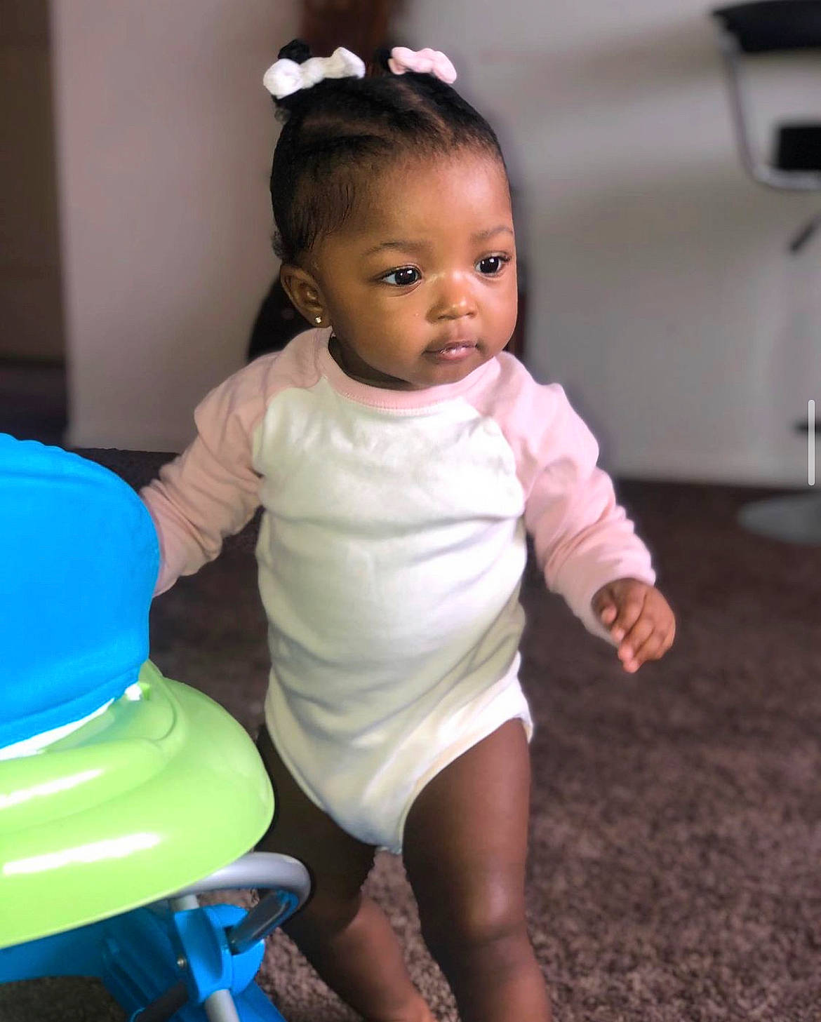 Sanaa joined the competition — help win amazing prizes! baby, baby_toddler_clothing, blue, cheek, child, drinkware, electric_blue, fun, hair, happy, head, human_leg, iris, organ, person, plastic, plastic_bottle, riding_toy, sitting, skin