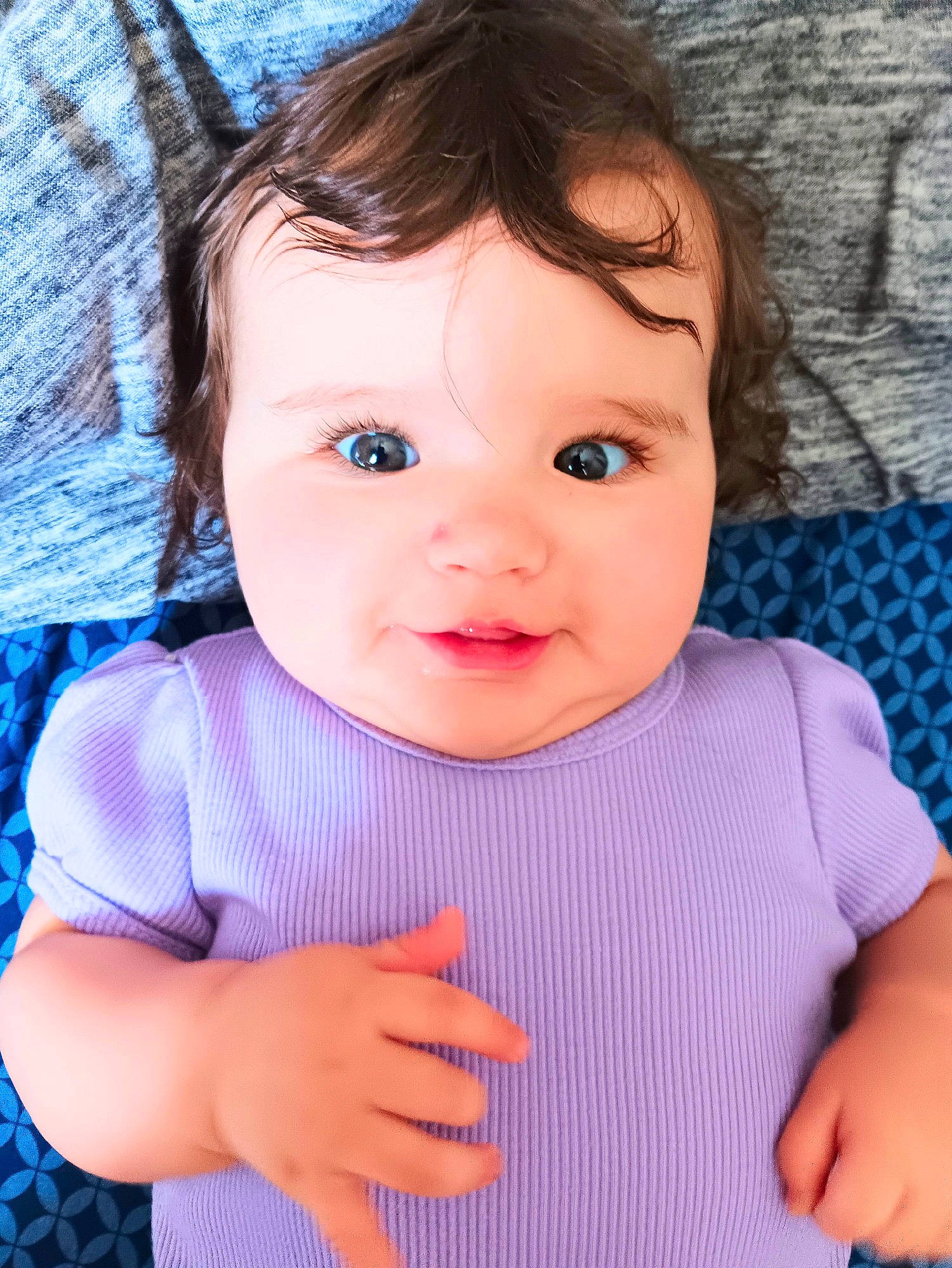 Kaylee is registered to the contest to win money with this photo: azure, baby, baby_toddler_clothing, blue, cheek, chin, cool, eye, eyelash, facial_expression, finger, gesture, happy, iris, lip, nose, person, pink, skin, sleeve
