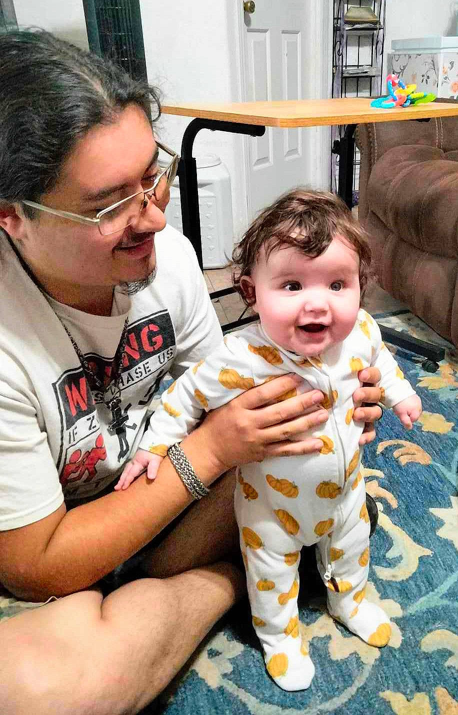 Kaylee is registered to the contest to win money with this photo: baby, baby_toddler_clothing, chair, child, event, eyewear, face, facial_expression, fun, glasses, hairstyle, happy, joy, person, room, sitting, skin, smile, t_shirt, toddler