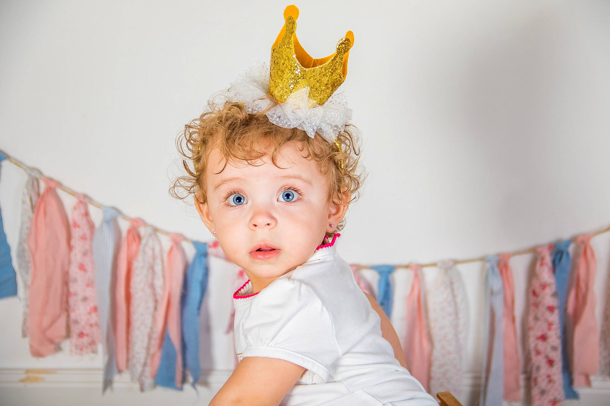 Cierra joined the competition — help win amazing prizes! baby, birthday, child, costume_accessory, costume_hat, crown, ear, fashion_accessory, fictional_character, hair_accessory, head, headgear, headpiece, party_hat, party_supply, person, portrait_photography, room, surprise, toddler