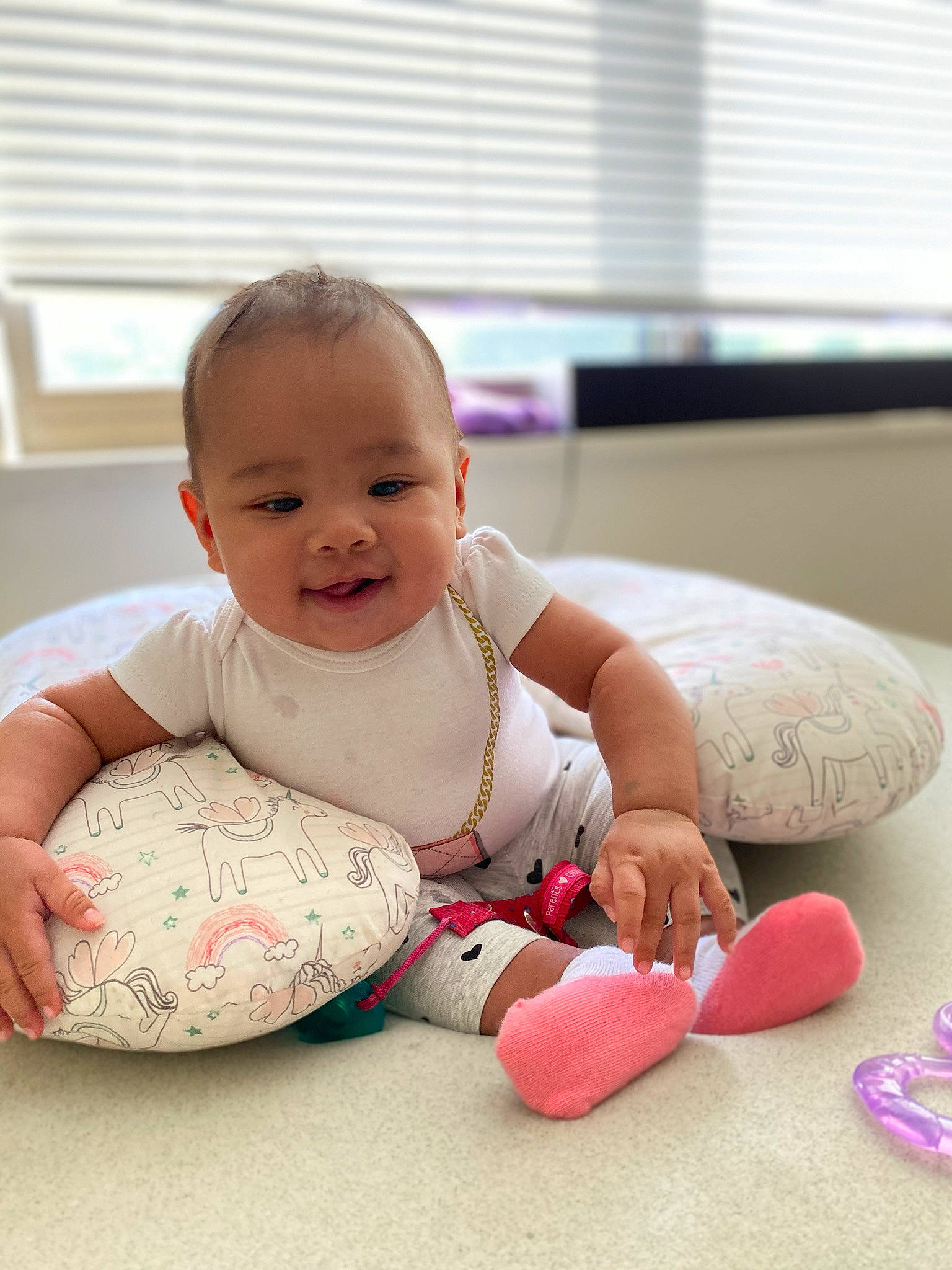 Adeya is registered to the contest to win money with this photo: baby, baby_toddler_clothing, child, joy, person, pink, play, product, room, sitting, skin, toddler, tummy_time