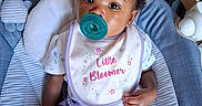 Phor'Ever joined the competition — help win amazing prizes! adorable, baby, baby_seat, bib, blanket, child, floral, hair_bows, indoor, infant, looking_at_camera, nursery, pacifier, pink_bows, portrait, purple_clothing, rocker, seated, smiling, striped_fabric