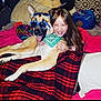 dog, child, girl, sunglasses, bandana, bed, blanket, pillow, smiling, happy, indoor, pet, friendship, playing, fun, casual, relaxed, cozy, animal, portrait