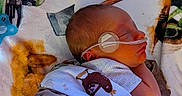 Blake joined the competition — help win amazing prizes! baby, bed, blanket, cozy, eye_patch, face, head, hospital, infant, medical, monitoring_tube, newborn, nursery, plush, portrait, resting, side_profile, sleeping, stuffed_animal, swaddled