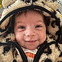 baby, child, hoodie, fluffy, animal_print, smiling, cozy, cute, face, closeup, infant, warm_clothing, zipper, happy, portrait, young_child, indoor, clothing, baby_clothes, headwear