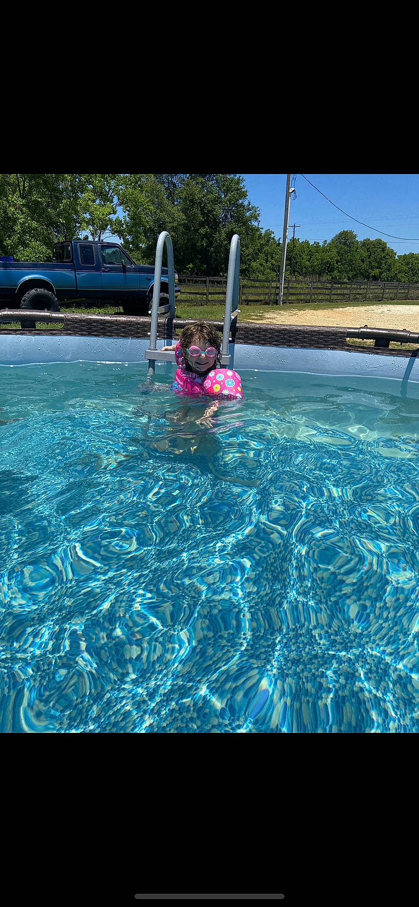 Kadence is registered to the contest to win money with this photo: aqua, azure, blue, car, electric_blue, fun, leisure, leisure_centre, nonbuilding_structure, ocean, person, recreation, sky, swimming_pool, tire, toddler, tree, truck, vacation, water