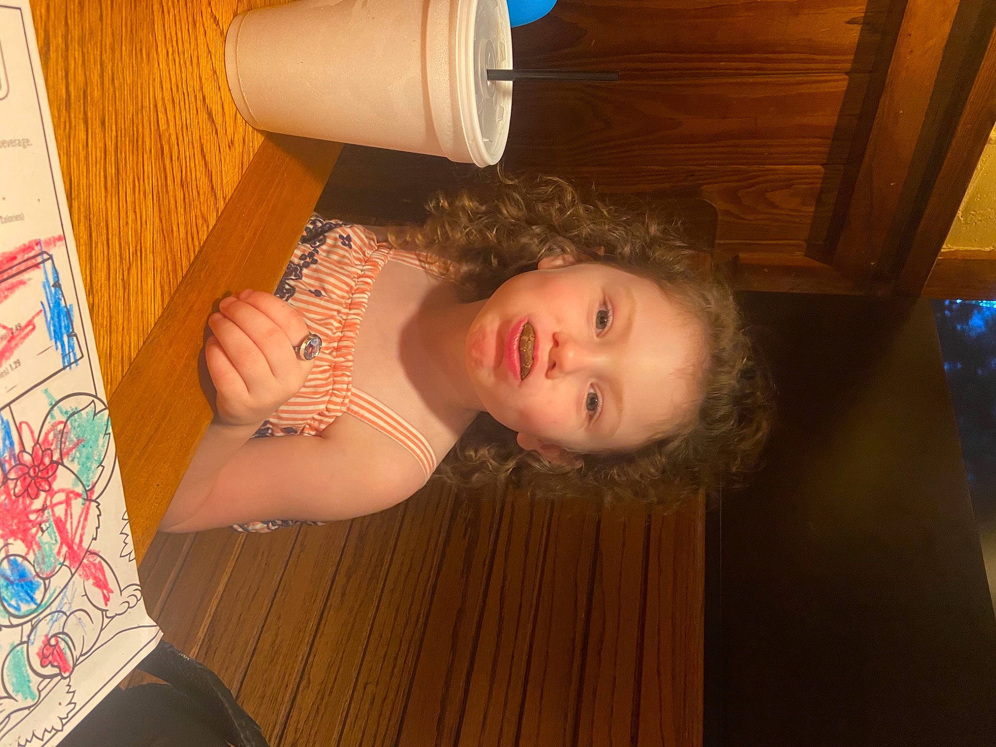 Kadence is registered to the contest to win money with this photo: abdomen, chest, child, cup, drinking, flesh, floor, flooring, fun, hardwood, human_leg, pattern, person, room, skin, toddler, trunk, varnish, wood, wood_flooring