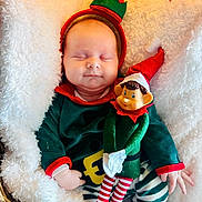 Rose participe au concours pour gagner de l'argent avec cette photo : baby, blanket, child, christmas_elf, costume, cozy, cute, elf_doll, festive, green_clothing, holiday, holiday_season, infant, red_hat, resting, sleeping, smiling_toy, soft_texture, striped_pants, toy