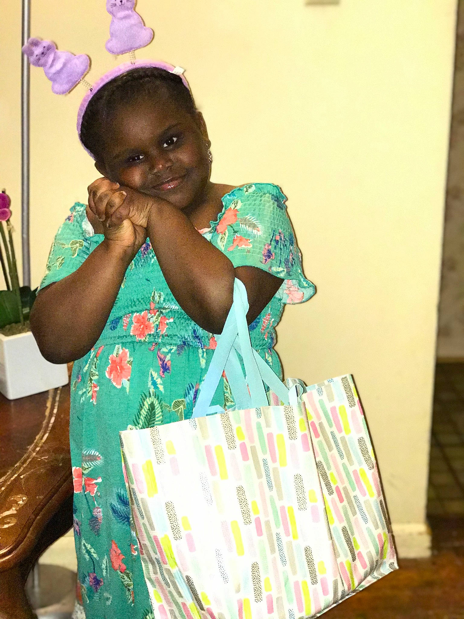 Saniyah is registered to the contest to win money with this photo: bag, child, event, fashion_accessory, fashion_design, fun, happy, jewellery, joy, linens, magenta, paper_product, party, party_supply, pattern, person, play, room, sitting, smile