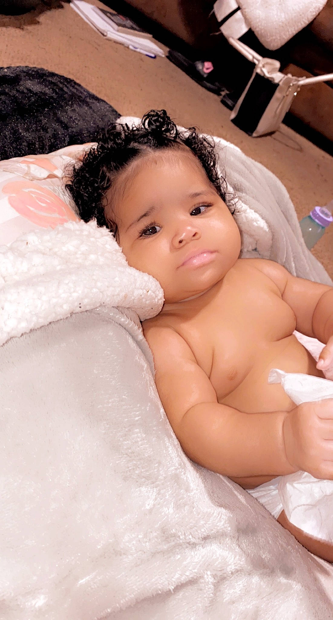 Kylah is registered to the contest to win money with this photo: baby, baby_products, baby_safety, baby_toddler_clothing, cheek, child, comfort, costume_accessory, eyebrow, hair_accessory, linens, person, skin, stomach, toddler