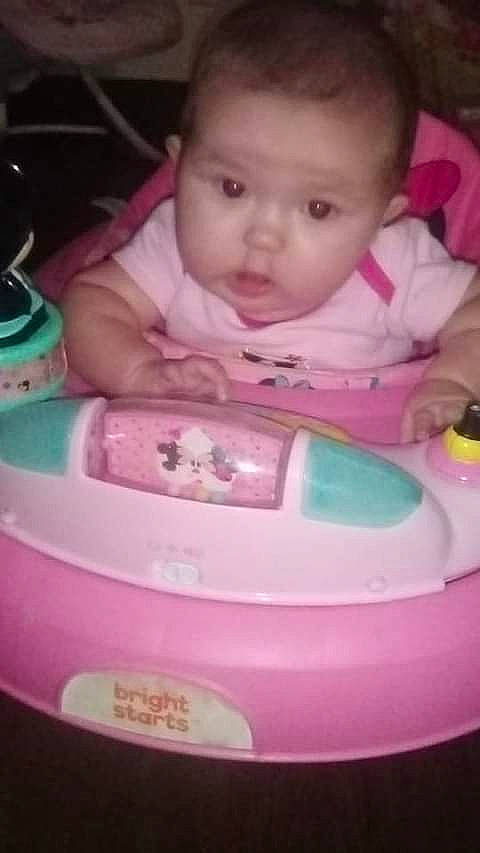 Kyrah is registered to the contest to win money with this photo: baby, baby_carriage, baby_products, baby_safety, baby_toddler_clothing, bib, cheek, child, eye, face, fun, head, mouth, nose, organ, person, photograph, pink, product, skin