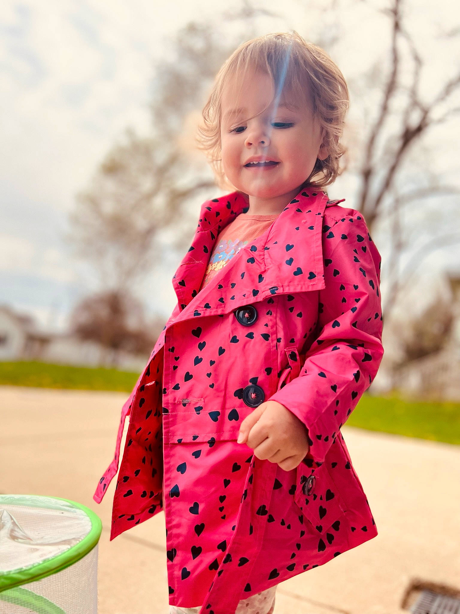Tilly joined the competition — help win amazing prizes! arm, baby_toddler_clothing, clothing, dress, face, facial_expression, happy, human_body, neck, outerwear, people_in_nature, person, pink, plant, shoulder, skin, sky, sleeve, smile, toddler