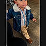 Adriel is registered to the contest to win money with this photo: brown_hair, casual_clothing, child, crop_mode, curious_look, cute, denim_jacket, fashion, flooring, indoor, khaki_pants, mobile_screen, person, photo_editing, portrait, small_shoes, standing, toddler, wooden_floor, young_child