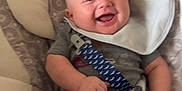Dallas Ray Jr. joined the competition — help win amazing prizes! baby, smiling, infant, seat, cushion, bib, clothing, safety_strap, happy, child, indoor, person, cute, young, human, portrait, seatbelt, comfort, baby_gear, relaxed