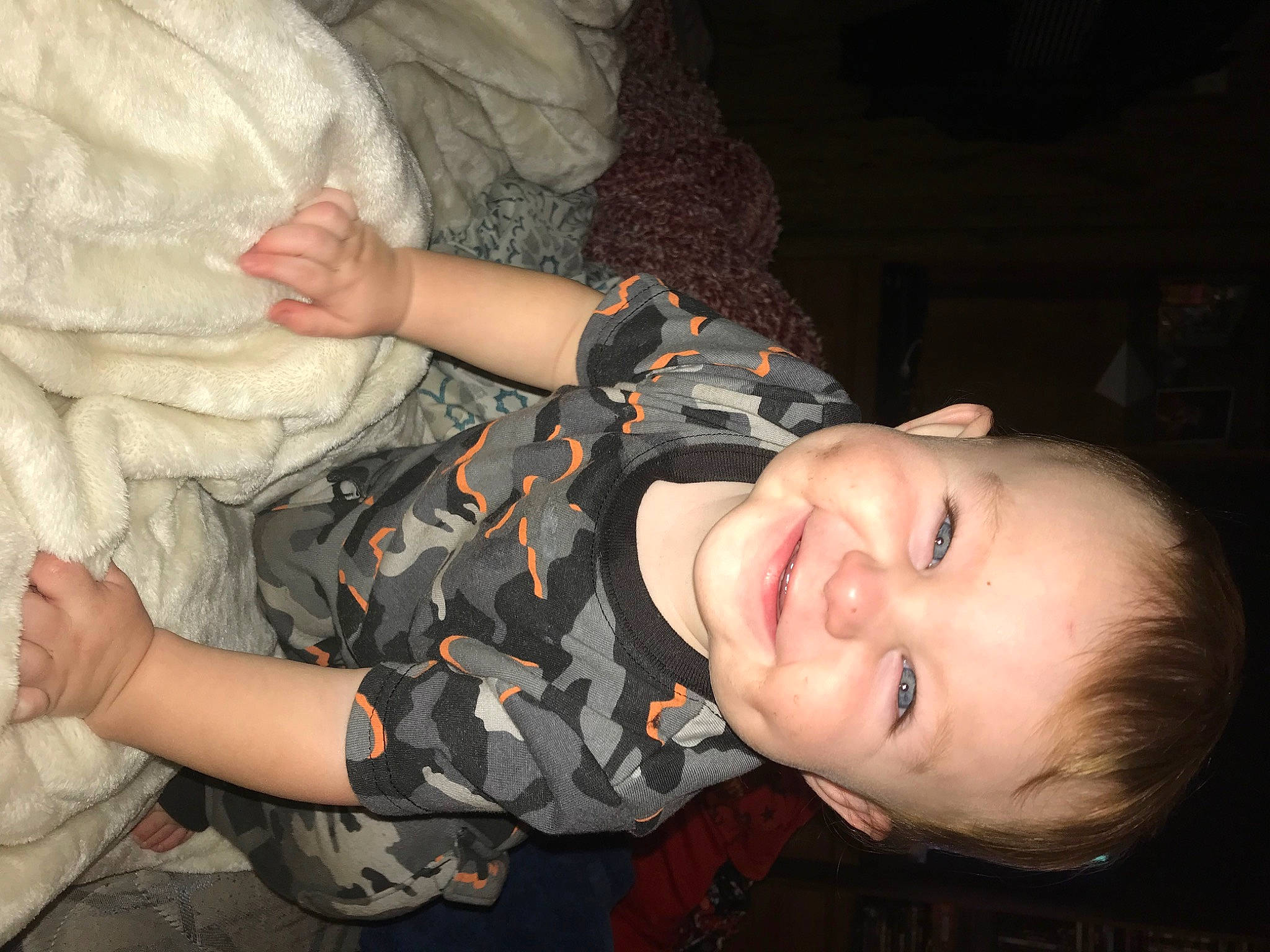 Parker is registered to the contest to win money with this photo: abdomen, chest, child, finger, flash_photography, fun, gesture, happy, interaction, joy, military_camouflage, mouth, nail, nose, pattern, person, skin, sleeve, smile, thumb