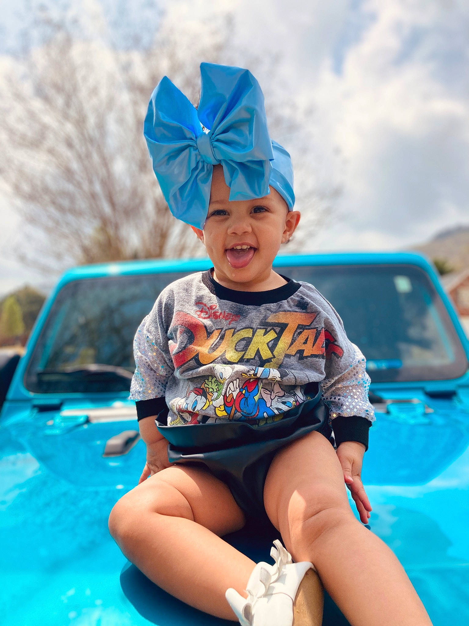 Jesslin is registered to the contest to win money with this photo: aqua, automotive_design, automotive_exterior, automotive_lighting, azure, blue, bumper, cap, car, cool, fun, happy, headwear, hood, leisure, motor_vehicle, person, recreation, summer, toddler