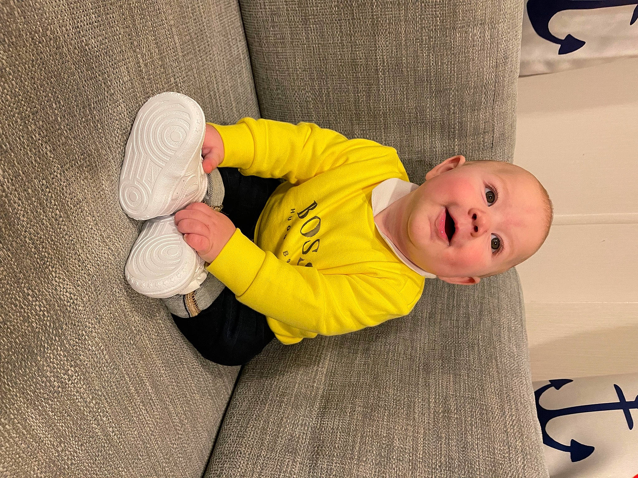 Riley-lee is registered to the contest to win money with this photo: baby, baby_toddler_clothing, carmine, child, comfort, finger, flooring, foot, fun, happy, hat, human_leg, linens, person, room, sitting, smile, textile, thumb, toddler