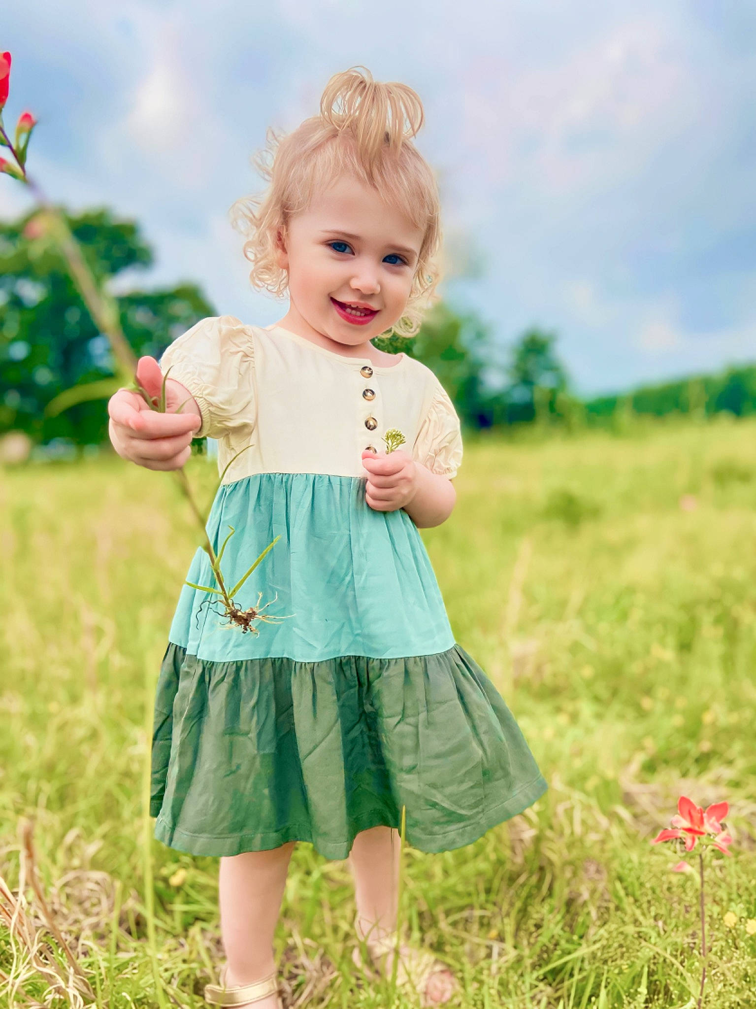 Olivia joined the competition — help win amazing prizes! baby, baby_toddler_clothing, beauty, cloud, day_dress, facial_expression, flag, fun, gesture, grass, grassland, happy, joy, meadow, people_in_nature, person, plant, sky, sleeve, smile