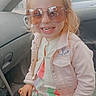 Louna participe au concours pour gagner de l'argent avec cette photo : accessories, blonde, child, clothing, coat, face, female, girl, glasses, hair, happy, head, jacket, pants, person, photography, portrait, sitting, smile, sunglasses