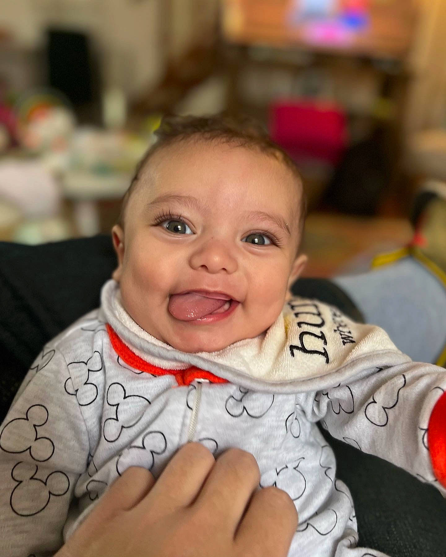 Easton is registered to the contest to win money with this photo: baby, cheek, child, ear, eye, face, finger, fun, gesture, happy, head, human_body, iris, lip, mammal, mouth, nose, person, skin, smile