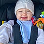 Tommy joined the competition — help win amazing prizes! baby, infant, smiling, car_seat, knit_hat, toy, clothing, blue_bib, cute, child, happy, indoor, seatbelt, safe, soft_texture, winter_clothes, closeup, portrait, human, joy