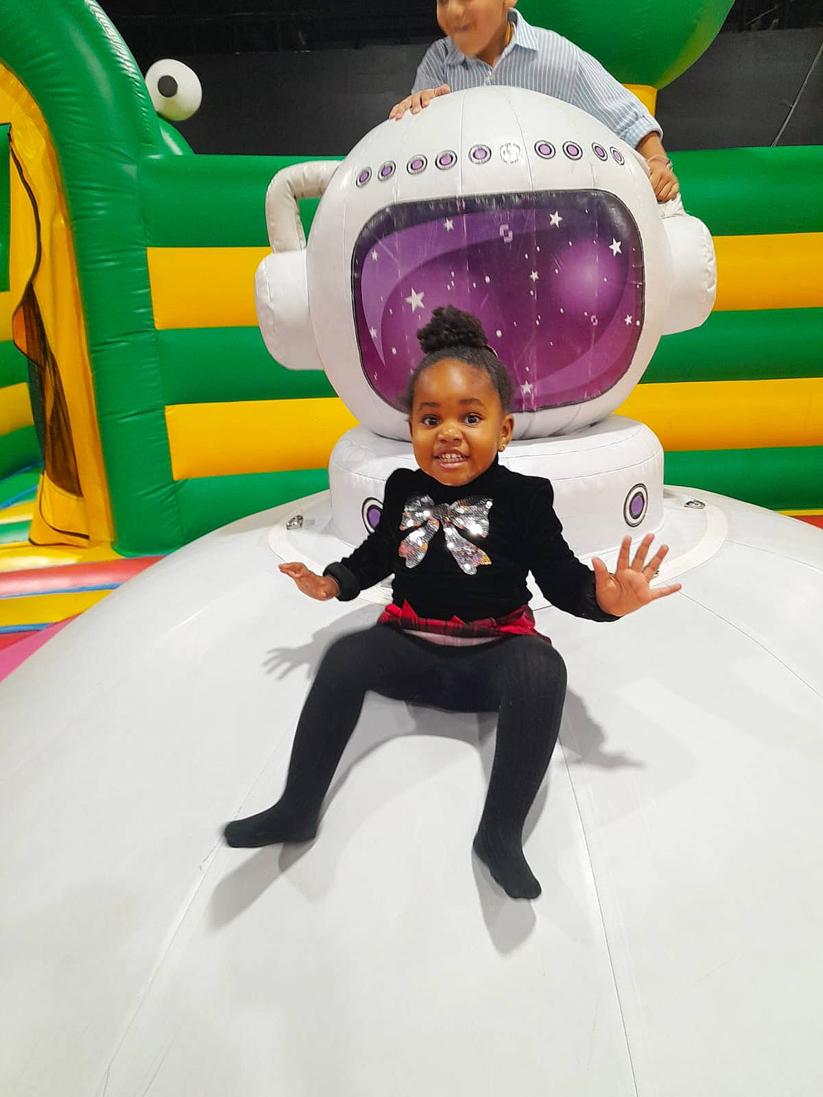 Praise is registered to the contest to win money with this photo: balloon, entertainment, event, facial_expression, fictional_character, fun, games, happy, inflatable, joy, leisure, magenta, outdoor_play_equipment, party_supply, performing_arts, person, pink, playground, purple, recreation