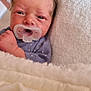 baby, blanket, child, closeup, clothing, cozy, cute, face, head, indoors, infant, newborn, pacifier, person, resting, skin, sleepy, small, soft_texture, wrapped