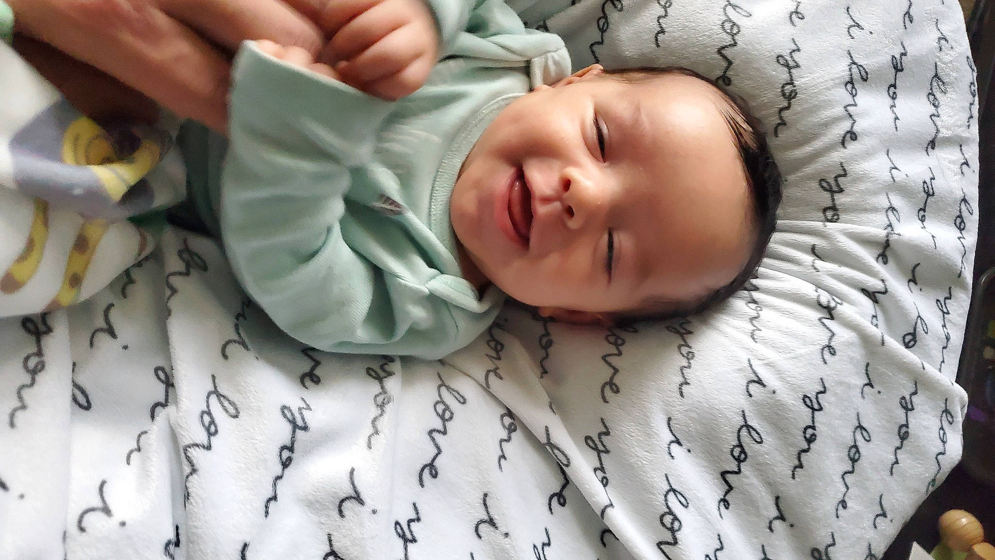 William joined the competition — help win amazing prizes! baby, baby_safety, baby_sleeping, baby_toddler_clothing, bedding, bedtime, child, comfort, face, happy, linens, pattern, person, photograph, room, skin, smile, textile, thumb, toddler